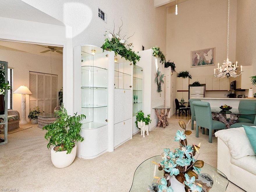 E-Z-2-C and ready for quick occupancy!  Great location in North Naples close to Vanderbilt Beach and Mercato.  Corner second floor condo with a view of the expansive park-like setting and at a perfect price makes this one you’ll want to see first!  Soaring 20 ft. cathedral ceiling, light and bright spaces and a West facing balcony, are just a few of the features that sets this condo apart.  New renovated Clubhouse and heated pool & spa and located in a quiet neighborhood.  Movie theaters, shopping, great restaurants & nightlife, library and tennis within minutes.  If you’re thinking of a year-round, seasonal or investor purchase with many amenities nearby - call now to schedule a private showing!