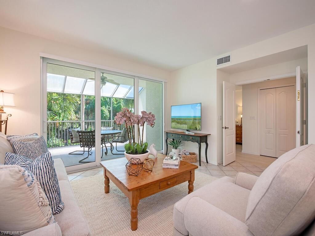 Photo of 7671 Pebble Creek CIR #101, NAPLES, FL 34108 (MLS # 225078416)