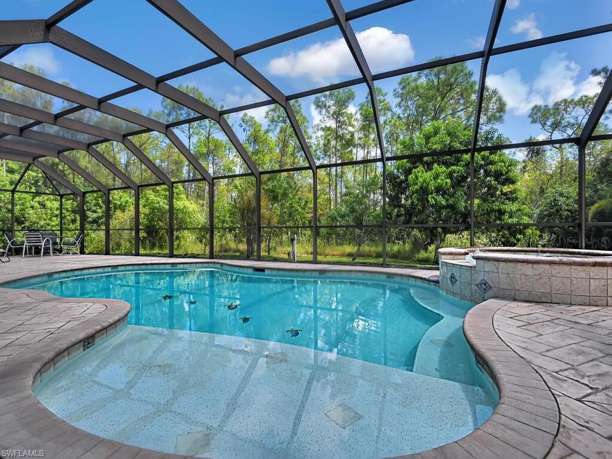 Tranquil setting, GUEST HOUSE, pool/spa, fruit trees and 3,000 sq ft main living! What more could you want on 1.25 acres of land with no HOA or restrictions. Looking for privacy and space? This home is perfect for you and invites an additional rental income opportunity featuring a 728 sq ft guest house with a living area, full kitchen, bathroom, bedroom and den. The main home boasts an oversized master bedroom with separate sitting area and access to a BONUS ROOM which would make for a wonderful nursery or workspace. Open kitchen, split floorplan, granite and tile throughout the main with luxury vinyl floor coverings in the bedrooms. There is also an additional shower in the utility room for pool guests. Landscape lighting and a fully paved drive to allow for ample guest parking. Complete with oversized pool cage and hot tub. Live worry free with newer mechanicals.  THREE A/C units (2019, 2019,2014), ROOF 2016.