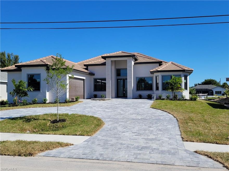 Brand new Gulf Access 3+den, 3bath single family  pool home. Upgrade galore includes: European modern style kitchen cabinets, quartz countertops, tiled through out the house, high tray ceilings with special LED lighting, installed fire place and TV in living room. Outdoor kitchen fully equipped with grill, cooler. Paved driveway, seawall.