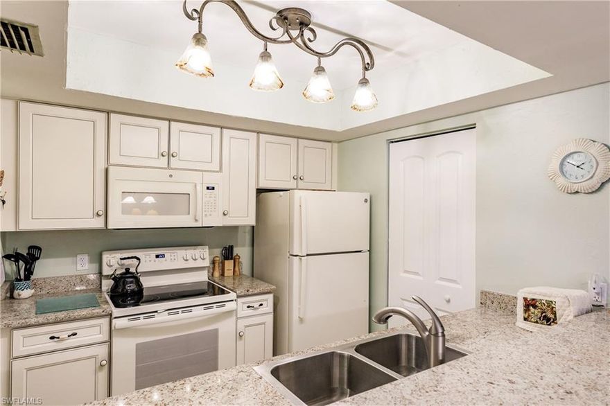 Beautiful townhouse in Timberwood Village - 2 story home - no one is above or below you! Turn-key furnished. Charming and updated, home features wood look plank tile throughout the lower level, vaulted ceilings for an open and airy feel, 2 Bedroom plus "extra" bonus room and 2 full baths.  "Extra" bonus flex room could be used for nursery, den, - whatever your needs may be. Recent updates include designer kitchen cabinets and granite countertops ~ both bathrooms updated too! This home is move in ready! French doors lead to the screened and covered lanai with view of wooded area, very private.  Timberwood Village is a rare low density community tucked away down Island Park Rd. with plenty of greenspace to enjoy. Community pool and a community boat ramp located on the Ten Mile canal perfect for kayaks, canoes and jet skis. Great location close to dining, entertainment, shopping, airport, healthcare and those beautiful beaches of Fort Myers, and Sanibel Island. Call  today to arrange for  a showing, you will not be disappointed!