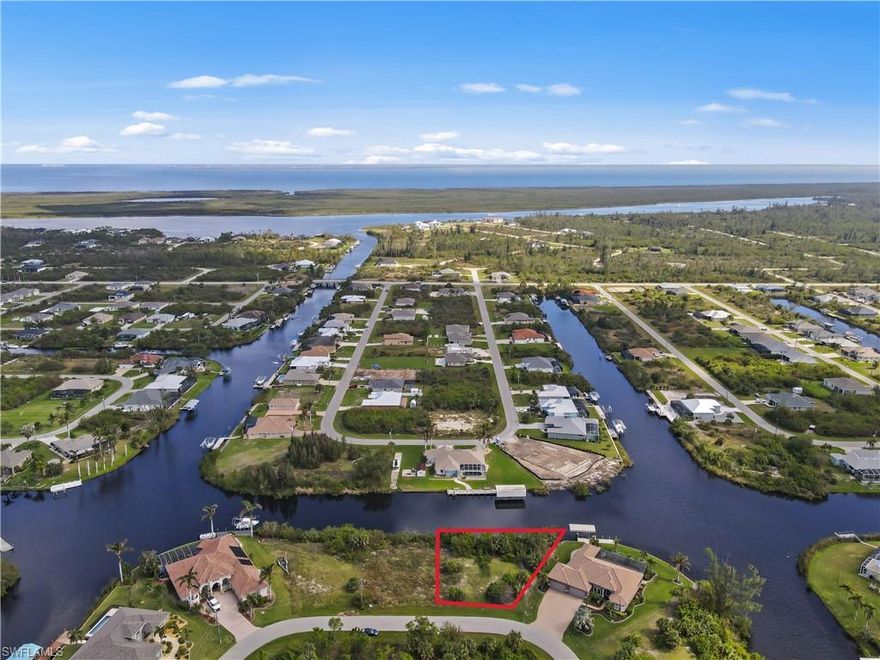 RARELY AVAILABLE and RECENTLY CLEARED, OVERSIZED WATERFRONT LOT IN THE DESIRABLE WATERFRONT COMMUNITY OF SOUTH GULF COVE! With an AMAZING 133 FT OF WATER FRONTAGE! and BEAUTIFUL INTERSECTING CANAL VIEW, this is a PRIME LOCATION for YOUR FLORIDA DREAM HOME! With Many Reputable Local Home Builders, You'll Be Living the Envied Florida Lifestyle in no time! With World Class Fishing, Boating, Shelling, Golfing, Bird Watching and So Much More to Enjoy! Gorgeous Gulf Beaches are Nearby, including Popular Boca Grande, Manasota Key and Englewood to name a few! Enjoy your mornings with your favorite beverage watching the Beautiful Sunrise, with eastern exposure from your lanai! You can Fish from your own Dock for Many Varieties, including Snook, Red Fish, Tilapia, Small Tarpon, Mullet and more! South Gulf Cove is a Popular, Fast Growing Boating Community that includes a Playground, Parks, Public Boat Ramp, Recreation Center and more! With Only One Bridge Out and Quick Boating Access to the Interceptor Lagoon, Where You Can Spend the Day Fishing or just Lounging on Your Boat! Or go out through the South Gulf Cove Lock (now manned) for a short ride to the Charlotte Harbor and Out to the Gulf of Mexico! Nearby to Shopping, Restaurants, Golfing and Beautiful Gulf Beaches! HOA is Optional. This Oversized Waterfront Lot Boasts 13,346 square feet to Accommodate a Spacious, Forever Home! Venture to Charlotte Harbor and the Gulf for More Amazing Fishing and Dolphin Sightings! For the Adventurer, Continue on to the Boca Grande Pass and out to the Gulf of Mexico for an Extraordinary Day of Fishing, Water Sports, Island Hopping, Swimming and So Much More!