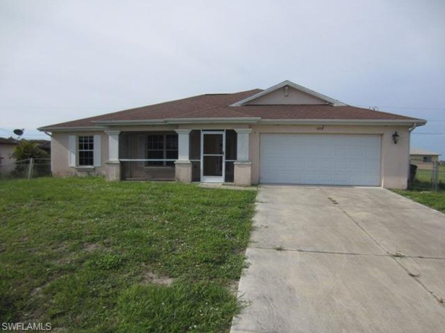 AWESOME 3BR/2BA+DEN home in Northeast Cape Coral. The spacious interior features open floor plan with soaring cathedral ceilings above newer wood-like flooring. Kitchen is located to optimize entertainment and living space. Master bedroom is open and "roomy" with walk-in closet and the Master Bath features separate tub/shower and dual sinks. On the exterior, the yard is fenced and there is ample room for a pool! Location is close to shopping, entertainment and other services. Don't Delay-Schedule a showing TODAY!!