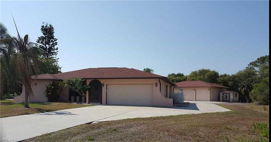 CAR, BOAT, RV OR BIG TOY ENTHUSIASTS, This home is for you.  2100 sq. ft. Pool home sits on 1.32 Acres, with a beautiful pond and a 1536 sq. ft A/C,  Out Building.  This is not a pole barn, it is the real thing.  Wide and tall doors, make it easy to bring all the toys inside out of the elements.  Nice solid pad is perfect for an RV.  Home offers 3 nice size bedrooms, Living Room, Dining Room and Family Room.  Enclosed lanai is large and great for entertaining.  Sit out at the pool and enjoy the beautiful water and wooded views.  Conveniently located to all that SW Florida has to offer.  This is a hard to come by piece of property with great opportunities.  Make your appointment today.