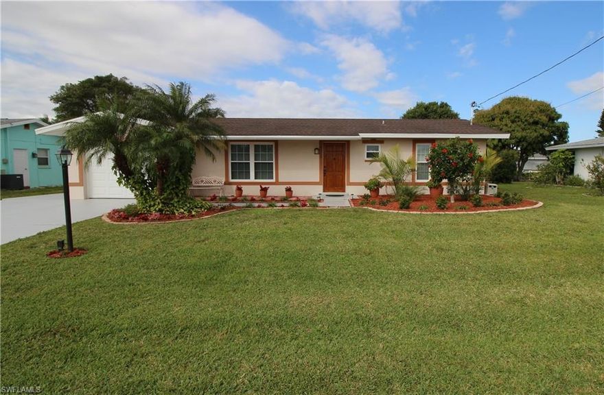 This beautifully landscaped 2 Bedroom 2 Bath home is located in Waterway Estates and is situated on a Direct Sailboat Access Canal that is only Minutes to the Caloosahatchee River. The home has a Western exposure and and 75' of waterfront. Interior features include Stainless Steel Appliances, Granite counter tops, Travertine floors and shower enclosure,  in-wall and ceiling surround sound, Maple cabinets, restaurant style gas cook top, newer A/C and duct work, new roof in 2004, new thermal pane windows in 2009, finished garage, high-end ceiling fans and a Mahogany front door. The Property is being Sold Furnished, minus a few excluded items.