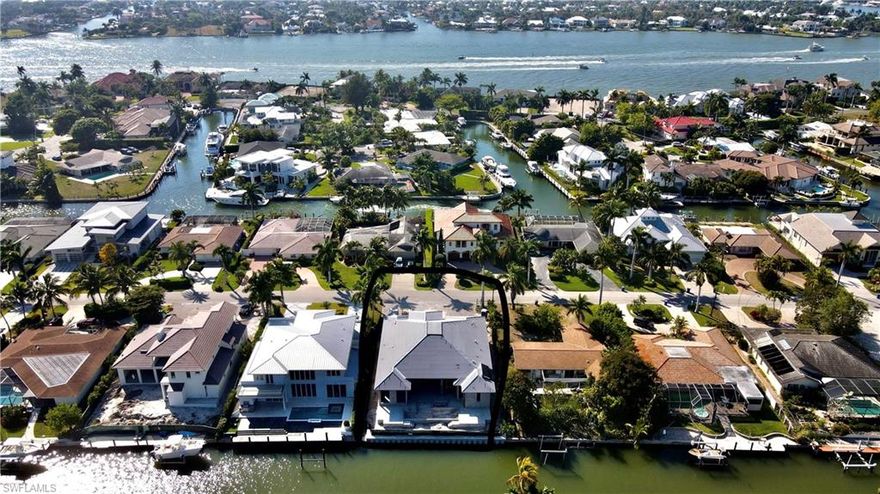 New construction, waterfront home in the highly sought after community of Royal Harbor (known to boaters for its water direct access and close proximity to both the Gulf of Mexico and Naples Bay. Minutes away from Downtown Naples with its fine dining, shopping, and famous beaches). This one story, coastal Florida inspired home by Falcon design is being built by Greenwald Builders and is scheduled for completion in August, 2021. The spacious outdoor living area with a summer kitchen is ideal for entertaining; overlooking the large pool with its sun ledge and spa. This property will have a new seawall and boat dock. Some of the features you will find inside this 4 bedroom home include a wet bar, Thermador appliances, and 48” cooktop. Generator ready and prewired for AV. Pictures are past homes completed by Greenwald Builders, not of current home.