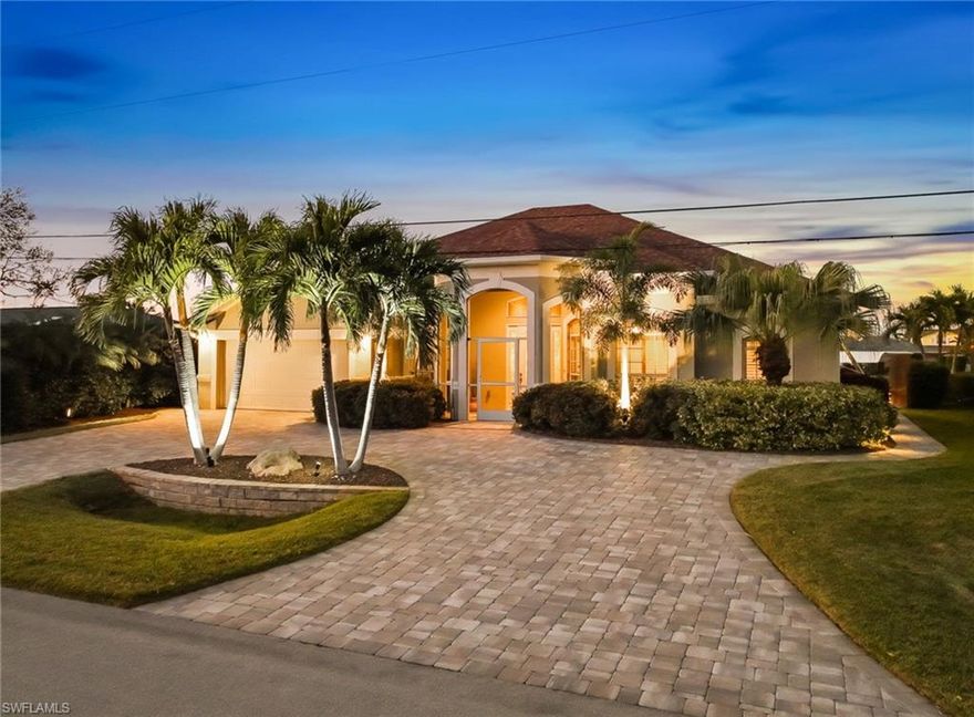 Enjoy Exceptional WATERFRONT Living In This METICULOUSLY MAINTAINED 2500 SF Home Offering A Short, DIRECT Boat Ride To The River Along With A 14,000 lb BOAT LIFT With New Canopy, A Captain's Walk, And A Personal Watercraft Lift Ideal For Two Kayaks, One Pedal Boat, Or Wave Runner. A Heated SALTWATER POOL AND SPA Complete This Incredible Setting, Making It Perfect For Boating, Entertaining, And Relaxing In Style. The Outdoor Living Space Is Further Enhanced By An Impressive OUTDOOR KITCHEN Complete With Grill, French Drain Sink, Side Burner, And Refrigerator, All Overlooking The Beautiful Pool Area Featuring Gorgeous TRAVERTINE Stone On The Lanai. ELECTRIC STORM SMART SHUTTERS Protect The Lanai, While Lexan Shutters On The Front Windows And Drop-Down Shutters On The Remaining Windows Provide Added Peace Of Mind. Inside, You’ll Find A Large Kitchen With Abundant Solid Surface Countertop Space And Wood Cabinetry That Is Ideal For Both Everyday Living And Entertaining. PLANTATION SHUTTERS Add Timeless Style Throughout The Home. The Spacious Master Suite Offers Dual Sinks, A Walk-Through Shower, A Deep Soaking Tub, And A Huge Walk-In Closet, Creating A True Private Retreat. Additional Highlights Include A New Water Heater, An OVERSIZED Garage With EPOXY Flooring, Sink, And Dedicated Work Area With A Workbench, As Well As A Paver CIRCULAR DRIVEWAY And Paver Walkway Leading To The Dock Area For Added Curb Appeal And Convenience. Check Out The FLY THROUGH Virtual Tour And Schedule Your Personal Tour Today!