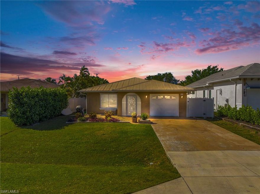 Convenience and luxury living in this remarkable Naples Park home. Imagine life where the vibrant Mercato, with its shopping, upscale movie theater, live music, fine dining, and special events, is just a stone's throw away—no need to drive! This highly sought-after locale, home offers a unique serenity, shielded from road noise, and only a short, 1 mile stroll to Vanderbilt Beach. If you're seeking a lively urban lifestyle or a smart investment, this will realize your dreams. Thoughtful upgrades, metal roof, energy-efficient double-pane windows, and storm shutters ensure peace of mind. Inside discover the elegance of porcelain tile flooring, crown molding, and the Caesarstone Quartz kitchen countertop. Both bathrooms have been thoughtfully updated, with the master bath receiving a stunning remodel. Privacy is paramount, and the fenced backyard creates a tranquil retreat for you to unwind. An expansive 400 sq ft enclosed lanai beckons you to embrace the Florida lifestyle, the brick paver patio is an inviting space for gatherings. Modern comforts such as a tankless water heater and front-load washer with steam dryer. A one-car garage adds to the convenience of this impeccable home.