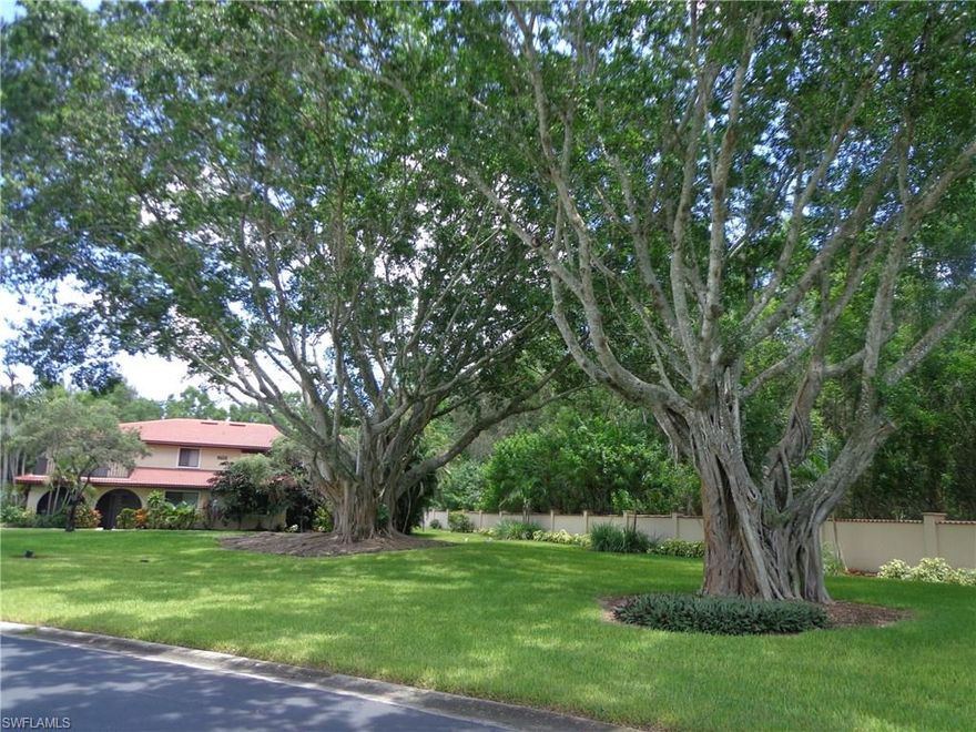 Discover why folks love Hacienda Village! As soon as you drive in the gate, you notice the lush landscaping, the spacious green spaces, the huge old ( valuable too! ) trees, and tons of flowers and flowering trees. Besides wanting to just spend time OUTSIDE  in this lovely community, then, you come home-- to your very classy 2 bedroom 2 and a half bath townhouse, with a private preserve on your south side. You can spread out in this 1800 sf plus whether inside or on your sun deck or your screened lanai. The great room concept features new paint, new carpet, newer tile, new kitchen with granite, stainless, and maple cabinets. The neutral paint colors really compliment the floor plan. It's nice to have the bathrooms already remodeled!  Two sets of sliding glass doors lead out to the lanai from the living room and dining room, making the whole area a huge expanse.  New AC  in 2016. Hacienda Village is a resident managed neighborhood with fees of only $225 a month! Shopping is within walking distance for most, Bonita and Collier County beach is just 3 miles away. But NO flood zone! You can't beat it there. Please see the virtual tour, then come and see us!