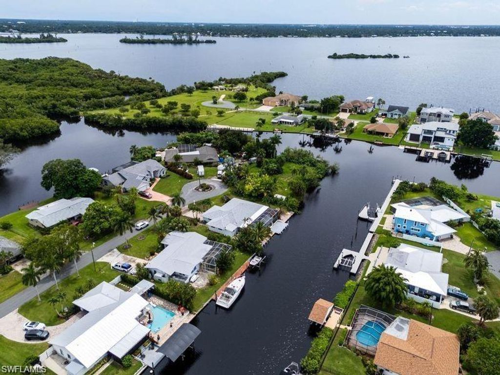 Photo of 2153 Channel WAY W, NORTH FORT MYERS, FL 33917 (MLS # 225083767)