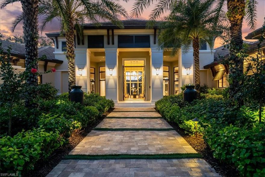 This exquisite estate home offers luxury and sophistication.  The thoughtfully designed Oakmont Model by Seagate Development Group features an open floor plan including a gourmet chefs kitchen with Thermador appliances, a stunning onyx bar with under-lighting, a massive glass wine room, motorized custom window treatments throughout, Control 4 home automation, electric hurricane shutters, 4 AC garages, a whole house Generac generator and more.The Master suite is a tranquil oasis with views of the pool and golf course from the bedroom and the the bathroom features pocketing sliders opening to a covered garden with a zen like water feature, dual sinks, a coffee bar with mini fridge and an additional washer and dryer.  The expansive outdoor space includes 4 distinct living spaces for outdoor entertaining and enjoyment, including an outdoor kitchen and bar, fireplace, dining and lounge areas with electric hurricane screens on covered areas, and a dedicated pool bath.  The infinity edge pool, spa, and water feature offer stunning Western views of the 9th fairway on the pristine Lakes course.  This lovely home is being sold furnished.