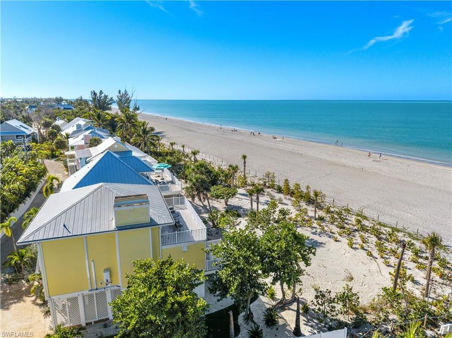 This beautifully remodeled beachfront home perfectly balances serene coastal living with the vibrant charm of island life. Ideally located in the heart of Captiva, this awesome getaway offers both privacy and spectacular water views that capture the essence of the island lifestyle. From every room enjoy breathtaking magical sunsets, a daily spectacle that never grows old. The gorgeous open-concept kitchen is designed for entertaining, while a cozy living room with beam ceiling and fireplace creates the perfect ambiance and feel. Upstairs you will enjoy 2 private guest suites that enjoy a huge deck overlooking the beach and Gulf of Mexico. Step outside to expansive outdoor living spaces, including screened and open lanais ideal for sunbathing, dining, or simply relaxing. A fully-equipped grilling station makes alfresco meals with family and friends effortless and memorable. This home offers a low-maintenance yet luxurious lifestyle in one of Captiva’s most sought-after locations. Just a short stroll from your door, explore charming shops, local restaurants, lively bars, and entertainment, the quintessential Captiva experience. The community enhances your lifestyle with amenities such as a large pool, tennis courts, and a bayside boat dock to enjoy world class fishing and dining options you can only get to by boat. With modern upgrades, walkable convenience, and tranquil outdoor spaces, it seamlessly blends the peacefulness of beachfront living with the excitement of island life. Looking for a weekly income producing property when your not enjoying, this home would be a rental income producing powerhouse! Embrace your island dream here, where every day feels like a vacation and sunsets are always spectacular.
