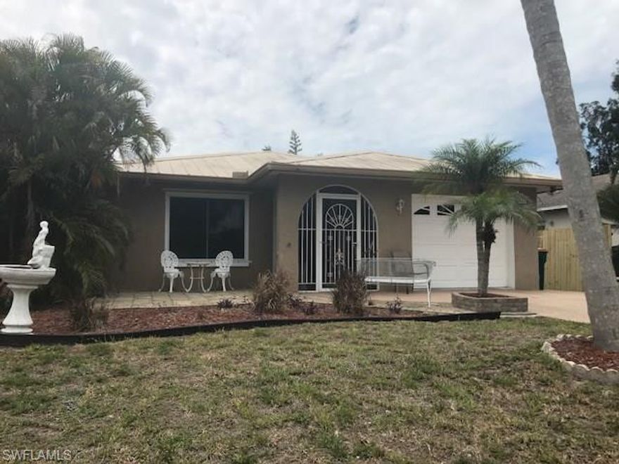 Imagine the freedom of not having to drive to Mercato to enjoy shopping, luxury movie theatre, live music, dining, special events, and more!  This *HOT* Naples Park location also has no road noise and is only a one mile shot to Vanderbilt Beach!  Owned by one family, this spacious furnished prime location home could very well be made yours to paint the town or keep as an appreciating investment.  Equipped with a metal roof, double pane windows, storm shutters, porcelain tile, crown molding, Caesarstone Quartz countertop in kitchen, updated showers in both bathrooms with master remodeled, fenced backyard for privacy, large 400 sq ft enclosed lanai, brick paver patio, gated front entry, tankless water heater, front load washer and steam dryer, and one car garage is now finally available as the best lowest priced opportunity ever!