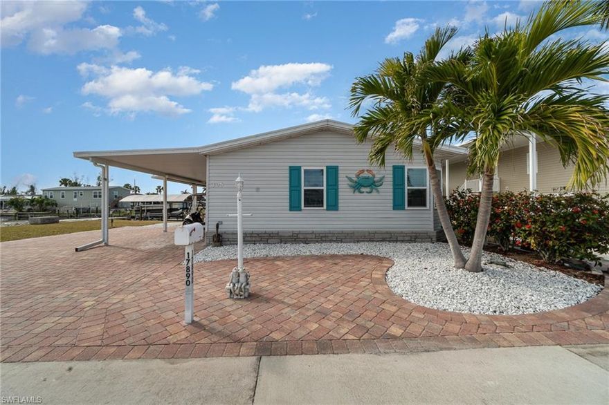 This beautifully remodeled turnkey furnished 2-bedroom, 2-bath canal-front home in Bayside Estates offers a rare opportunity to enjoy true Gulf-access living. Located in one of Southwest Florida’s most desirable 55+ boating communities, this move-in-ready residence combines coastal charm, modern upgrades, and an unbeatable waterfront setting.

The open-concept floor plan showcases upscale finishes throughout. The updated kitchen features granite countertops, new high-end appliances, built-in pantry storage, and a breakfast bar ideal for entertaining. The private primary suite includes custom built-in cabinetry and a spa-inspired shower designed for comfort and style.

Hurricane-impact windows and doors provide peace of mind, while the spacious two-car covered carport offers flexibility and could easily be enclosed for additional storage or workspace. Step out back to your private boat lift and enjoy quick, direct access to the Gulf.

Recent improvements include a roof replaced in 2018, AC in 2022, and a water heater in 2022. Bayside Estates offers an active social calendar, excellent amenities, and convenient proximity to beaches, dining, and shopping. The community clubhouse and office are equipped with a water barrier planking system up to 31 inches high and Cool Seal waterproof insulated paint. Buyers pay a one-time $2,800 resale capital contribution fee.
Don't miss out, schedule your private showing today.