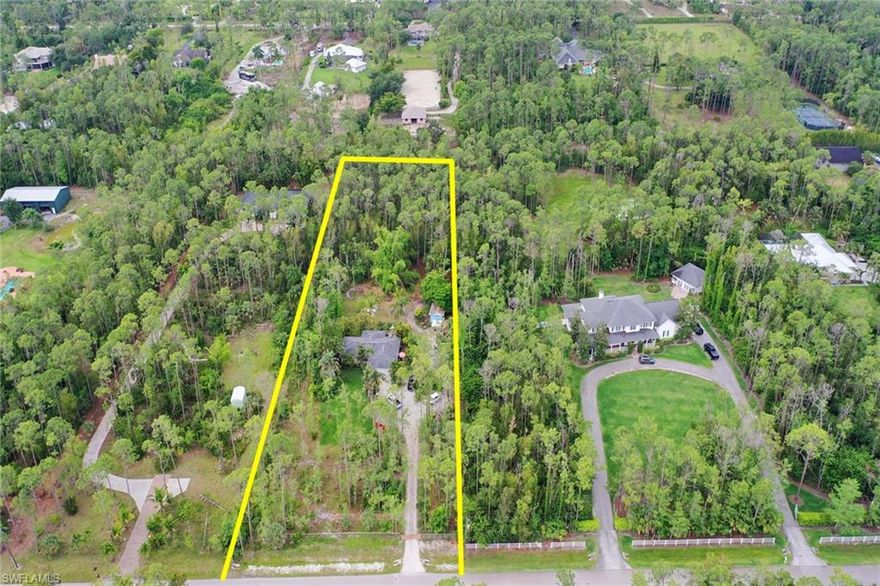 Country living feel with all the convenience of city life! This 2.5 parcel with a 3 bedroom/2 full bath home is in a desirable area of Naples, just South of Vanderbilt Beach Road and situated between Old Livingston Road & I-75. You can enjoy being having enough land for all of your "toys" and enough room for the entire family while being surrounded by natural Old Florida landscaping including tall pines & fruit trees. The home offers over 1,200sf of living space with both a screened in front lanai & a screened in rear lanai, impact glass windows in front part of the home, and a 2-car garage that has a/c. Well maintained property that is partially cleared in the front and has a long drive leading to the home and updated with a new roof 6yr ago, both bathrooms have been renovated, the a/c unit is only 10yrs old, and the septic was serviced (pumped) 5yrs ago. Located on a private paved road maintained by residents, surrounded by custom built single family homes all on 2+/- acres in a non-gated, no restrictions neighborhood. Plus, you will be close to I-75 and only 7 miles to Vanderbilt Beach.