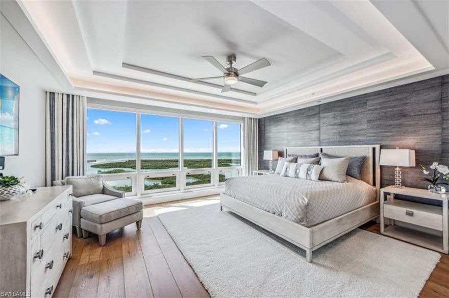 Experience the Pinnacle of Coastal Elegance at Kalea Bay
Step into a world of refined coastal luxury in this impeccably designed 3-bedroom + den, 3.5-bathroom residence located within Kalea Bay—one of Naples’ most prestigious waterfront communities. Every inch of this exceptional home has been thoughtfully curated by renowned designer Roz Travis to evoke an atmosphere of organic sophistication. A serene palette of soft whites, sun-washed beiges, and muted taupes blends harmoniously with custom millwork, rich textures, and hand-selected designer finishes, creating an ambiance of understated elegance.
The expansive open-concept floor plan is flooded with natural light, thanks to floor-to-ceiling windows that effortlessly blur the lines between indoor comfort and outdoor serenity. The spacious den offers a tranquil setting for work or relaxation and opens to its own private balcony—perfect for enjoying panoramic views of the golf course and the vibrant Kalea Bay Club. The main lanai spans the width of the residence, offering an outdoor sanctuary ideal for morning coffee and sunset cocktails.
The gourmet kitchen is both functional and beautiful—tailored for the culinary enthusiast with Sub-Zero and Wolf appliances, includig natural gas cooktop, waterfall-edge quartz island, and refined cabinetry that integrates storage with sleek design. 
The primary suite is a private retreat designed to soothe and restore with wall filled views.  The spa-like bath features dual vanities, an oversized walk-in shower, and a soaking tub that invites quiet indulgence. Two additional ensuite guest bedrooms ensure every visitor experiences the same level of luxury, privacy, and comfort.
Living at Kalea Bay means indulging in a lifestyle beyond compare, with exclusive access to five-star amenities: a spectacular rooftop pool with Gulf views, a brand-new state-of-the-art wellness center, multiple on-site restaurants, tennis, pickleball, and a vibrant social calendar—all nestled within a lush, waterfront setting.
Simplicity meets sophistication in this extraordinary residence, where modern luxury is seamlessly infused with the relaxed rhythm of coastal living. Discover the ultimate in high-rise living—just minutes from Naples’ famed beaches, fine dining, and world-class shopping.