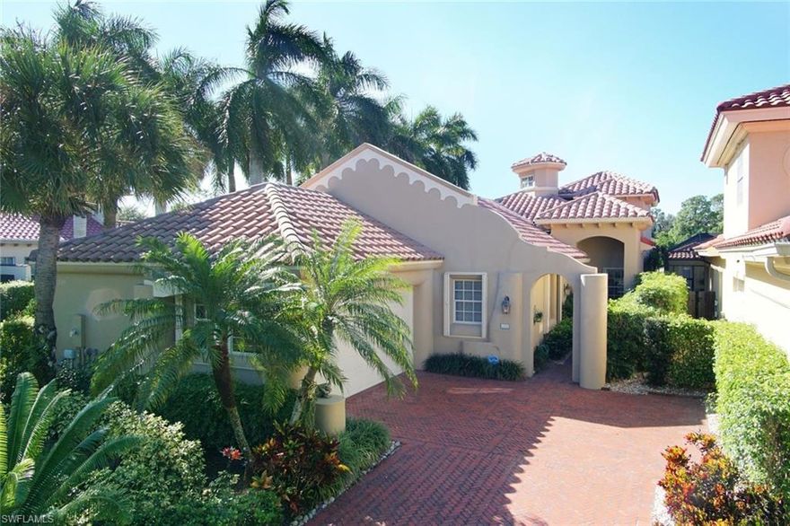 New reduced price in this spacious and bright 4 bedroom home with lake and golf views. Wood floors, fireplace in family room, built-ins, solar panel, filtered water and more. Master bedroom plus two guest bedrooms are on the first level.  Well maintained.  Pelican Marsh is located in North Naples near beaches, shopping, dining and the arts.    Seller is motivated and negotiable.  Bring all offers.