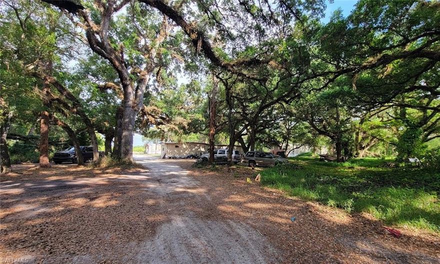 Mobile home rental park with 7 units situated on approximately 2.96 acres along desirable County Road 78! This property is a true diamond in the rough, already zoned for mobile home park use. It includes two houses—one a duplex—both requiring extensive repairs, as well as five older mobile homes ready for renovation or replacement. All units are currently rented on a month-to-month basis (please do not disturb tenants). Opportunities like this are rare, especially in an area surrounded by expanding gated communities and luxury homes.