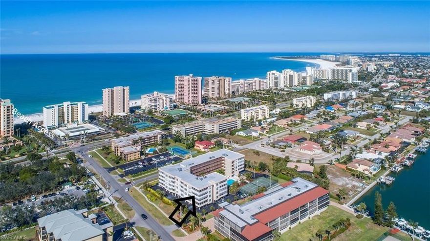 LOCATION, LOCATION, LOCATION....Fabulous location on the south end of the Island, so close to the south beach access! Fourth floor, 1278 square feet of a/c living space, the bigger of the two floor plans at Marisol as this is a corner unit, 2 bedrooms, 2 baths- both with walk in closets, split floor plan with each bedroom having access to the 280 square foot corner screened lanai with south eastern exposure. Bedroom windows have been replaced and are high impact, the lanai has newer electric shutters (2019), the A/C was replaced 2020 (compressor 2022), Hot water heater (2018). Covered parking space #402 located right under the stairs, extra storage, social room, tennis court, BBQ, wonderful pool area with chickee hut, washer & dryer in the unit, abundant natural light, friendly complex, much desired quick access to the beach.