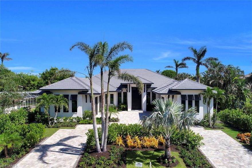 H.13060 - This Knauf-Koenig Group masterpiece sits in the heart of the Moorings community. Its sprawling single level design, along with a well-appointed chef’s summer kitchen, outdoor dining and living spaces, and a resort style pool; allow for effortlessness transitions from outdoor to indoor living. In addition to the expansive Master Suite there are 4 Guest Suites providing ample space for all your visitors. If this prominent Naples address suddenly increases your need for guest rooms… the third garage stall has all the provisions to be easily converted into a detached guest suite. ADDITIONAL FEATURES OF THIS HOME INCLUDE: a three car garage, an attached carport, roll down shutters, roll down shades, impact windows and doors, European Oak wide plank flooring, quartzite and marble counter tops, Wolf Sub-Zero appliances, outdoor fireplace, and eligibility for membership to the private Moorings Beach Park.