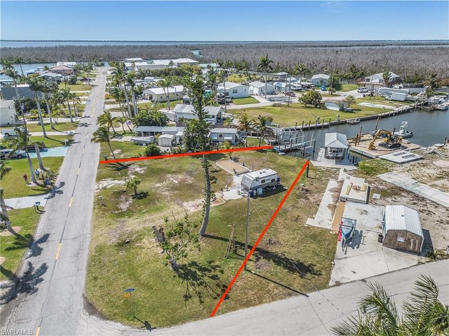 Large waterfront lot .21 (acres) / 9,235 (sqft) with a 7000 lb boat lift in St James City located on the Snook Canal. Just a few minutes by boat to the intracoastal waterway. Then you only need to decide where to go and enjoy the day. With many options to choose from like Fort Myers Beach, Sanibel, Captiva, North Captiva, Cabbage Key, Beautiful Cayo Costa Beach, and Boca Grand Pass. Whether you enjoy taking a long walk, golf cart ride, or going out to eat, you will find all of this and more in St. James City. There was a Mobile home on the property that has been removed.