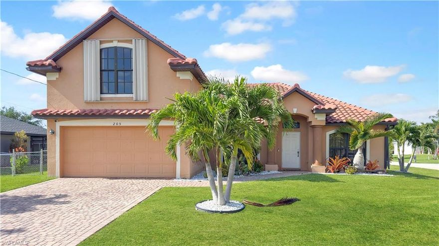 Professionally appraised pool home! This 4 bedroom, 3 bathroom home boats OVER 2,700sqft of living space and is strategically placed on a corner lot with Northern exposure. As you pull up you're welcomed by a paver driveway and mature landscaping with modern white rocks for a touch of sophistication. Through the front door, you're greeted by high ceilings and an open formal dining room connected to a large living room. The kitchen features warm cabinetry, solid surface countertops, and an oversized breakfast bar that's perfect for entertaining and everyday use! An OPEN FLOOR PLAN, the kitchen flows seamlessly to the family room, which offers easy access to the outdoors. Through the large sliders you will enjoy the IN GROUND POOL with an extra large SCREENED-IN LANAI, creating the perfect setting for sunsets, relaxing evenings, and entertaining guests. The guest bathroom features a tub/shower combo with POOL ACCESS. Located on the FIRST FLOOR, the primary bedroom is illuminated by natural light and boasts an impressive size with a walk-in closet! The primary bath features a dual vanity sink, soaking tub, and walk-in shower with glass doors. Located upstairs, you'll appreciate the privacy of the remaining guest bedrooms and additional guest bath which also features a shower/tub combo. There is also an additional living room space that could double as an office area, or hangout spot. Carpet in the main areas provide comfort while tile in the wet areas make cleaning a breeze. **ADDITIONAL FEATURES INCLUDE: 2021 AC, 2022 water heater, 2023 TILE roof!** GUTTERS throughout and a FENCED IN BACKYARD add to the home’s functionality and convenience. Located near Cape Coral's best dining and shopping, with easy access to Fort Myers and the beaches, this home has it all... The only thing missing is YOU!