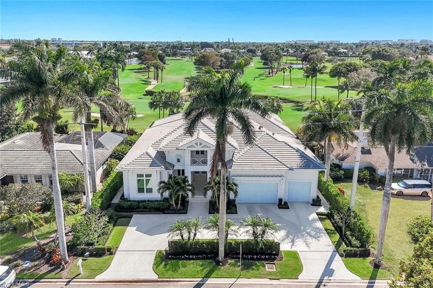 Located in the highly sought-after Moorings neighborhood of Naples, Florida, this exceptional 2023-built residence offers luxury coastal living with expansive golf course views over the Moorings Golf & Country Club. Boasting 4,173 square feet under air and 5,935 total square feet, this five-bedroom plus den, five full bath plus powder bath home combines timeless design with modern functionality. Wide-plank European white oak flooring flows throughout creating a light, bright, and airy ambiance. The Chef’s Kitchen includes 3" quartzite counters and marble backsplash throughout, Wolf, Subzero, Miele and Cove appliances, and a magnificent kitchen island. Discover the thoughtfully designed hidden walk-in butler’s pantry featuring an additional Wolf oven and abundant storage, ideal for entertaining and everyday convenience. The Bar and Dining areas feature a hammered sink, refrigerator drawers, and a Subzero wine refrigerator discreetly hidden behind custom built-in cabinetry, everything is truly at your fingertips. The Great Room offers a 20-foot vaulted ceiling and opens through 10-foot high glass sliders to the generously covered Southern Facing outdoor living space - which includes a gas fireplace, outdoor kitchen with Alfresco gas grill, quartzite countertops and an undercounter refrigerator - captures sweeping fairway views, designed for relaxation and entertaining, made complete with a resort-style salt-water pool and spa, and additional gas fire pit area. The entire outdoor living space is easily enclosed with the touch of a button offering automated bug screens and hurricane shutters. The spacious Primary Suite has Gorgeous views out to the golf course and pool area; offers dual walk-in custom closets, a spa-inspired bath with dual vanities, a free-standing soaking tub, and an oversized steam shower with multiple controls for a true retreat experience. The homeowner will also appreciate a home generator, Sonos sound system inside and out as well as Lutron smart home features.  The 3-car climate-controlled Garage includes epoxy flooring, plenty of space for storage and was uniquely constructed with 14’ ceilings to accommodate multiple lifts for the car enthusiast. Perfectly positioned just blocks from private beach access at the Moorings Beach Club, and minutes from shopping and dining at Venetian Village, Waterside Shops, and the renowned restaurants of Fifth Avenue South, this home offers the best of Naples luxury living in one of it's most desirable locations.