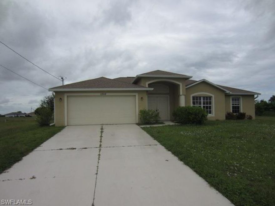 AWESOME 3BR/2BA POOL Home in NW Cape Coral. Home features almost 2,000 sq.ft of living area with open floor plan/dining area under soaring cathedral ceilings. Master BR is spacious with his/hers closets and Master Bath has dual sinks. Fantastic Pool area with large lanai for enjoying the true Florida lifestyle! Don't delay-schedule a showing TODAY!