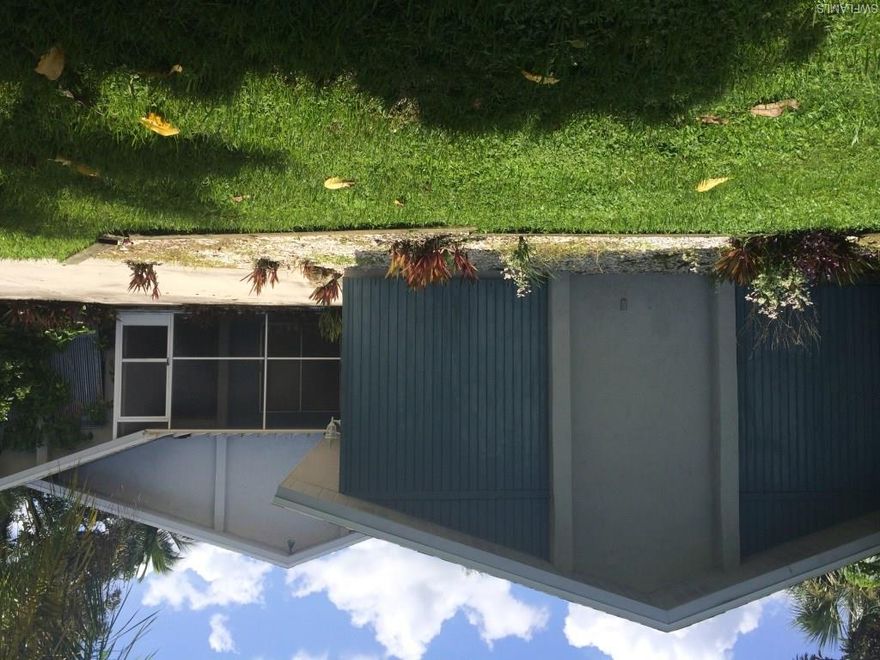 REDUCED!!! Serious Boaters, your home awaits. No bridges or restrictions and just minutes to the River! Great location, short drive by car or boat to restaurants, shopping,  entertainment and the Yacht Club. 
Large open great room with vaulted ceiling, fireplace, and lots of sliders to lanai & oversized screened in pool. 
Home features a 2 car side load garage and  fenced in yard. A little TLC and some updating and you can make this home your own. This has been in a rental program and can rent for  $1600 per month. Perfect for the investor or until you tear down and build your dream home!