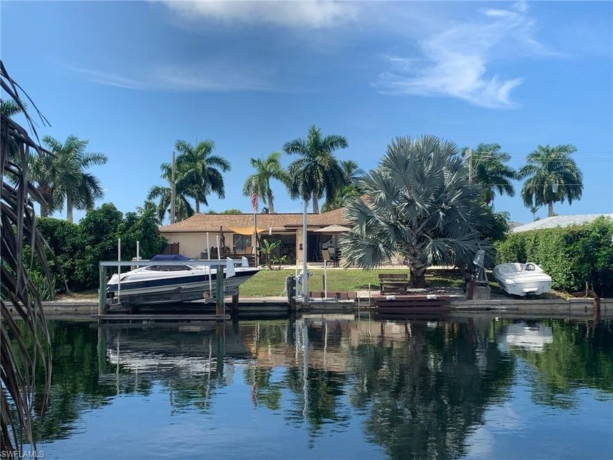 Boater’s dream! Lowest priced WATER DIRECT move-in ready home on Marco! Deep water location with quick way out to Marco River just minutes to Marco Island Yacht Club. No bridges to open water! Great location! Updated kitchen and baths. Wood plank and ceramic floors throughout. Bright kitchen with lots of windows and sliding glass door. White raised panel cabinets with granite tops and cathedral ceiling. Stainless steel appliances. Additional sliding glass doors in dining area open to large patio with big backyard. Plenty of room for a pool. 10,000 lb. boat lift with new remote control panel. Recent rental history (not including taxes/fees): 12/25/19-1/2/20 ($2,112) & 1/9/20-4/9/20 ($15,937) Walking distance to restaurants, entertainment, shops, ice cream spot and grocery store. Less than 2 miles to the beach. Marco Island is famous for its white sandy beaches, boating, water sports, and wide sidewalks all over the island, great for walking and bicycling.