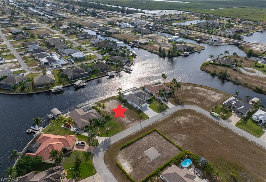 Gulf Access Dreams Start Here !!  

Fabulous Gulf-access waterfront homesite ready for your vision. Positioned on a wide intersecting canal with coveted southern exposure, this property already offers exceptional value with an upgraded seawall and additional truckloads of clean fill—a true head start in building your future home.

Picture this: you step out your back door, the sun warming the water, your boat waiting at the dock. With a turn of the key, you're off—navigating toward the Gulf of Mexico, world-class beaches, and storied islands like Cayo Costa, Cabbage Key, Sanibel, and Boca Grande. This is the kind of access that transforms everyday living into a life of adventure.

The neighborhood is lined with beautiful high-end homes, a testament to the quality and potential of this location. And for those who want more than waterfront living, everything you need is close by—an 18-hole championship golf course, the exciting Seven Islands development, great restaurants, shops, and recreation.

Travel is effortless with SWFL International Airport approximately 30 miles away and Punta Gorda Airport about 20 miles—perfect for snowbirds, investors, or full-time residents who crave both convenience and coastal beauty.