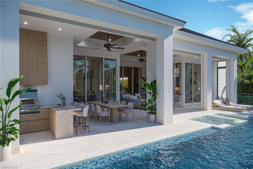 Experience coastal luxury at its finest in this impeccably crafted, southern-exposure waterfront masterpiece, built to the newest 10-foot base flood elevation. On a deep-water canal with direct Gulf access, this new residence pairs exceptional construction quality with an unbeatable Naples location, near Naples Bay Resort, Bayfront, Tin City and world-renowned 5th Avenue South. Naples iconic white sand beaches are only minutes away, offering the ultimate blend of convenience, lifestyle and waterfront living. Designed for modern living and effortless entertaining, this home features five bedrooms plus a den, 5.5 baths, a two-car tall garage with the ability to add lifts for four-car capacity, and 3,482 square feet of refined interior space. Designer-selected finishes and meticulous craftsmanship elevate every corner of the home. A custom tall mahogany front door opens to 12-foot ceilings, architectural ceiling treatments and European wide-plank oak floors that frame expansive water views. The great room showcases a dramatic cathedral ceiling, custom built-ins and a vapor fireplace wrapped in full marble. The chef-inspired kitchen centers around an oversized island with Taj Mahal quartzite countertops and is equipped with premier panel-ready appliances, including a 48-inch Wolf Dual Fuel Range, Sub-Zero Designer Column refrigerator/freezer, Cove dishwasher and Sub-Zero 24-inch wine and beverage coolers. The primary suite offers a serene waterfront retreat with dual custom wardrobe closets and a spa-like bath featuring natural stone finishes, a soaking tub and an oversized multi-head shower. Each guest suite includes its beautifully curated en-suite bath with custom cabinetry and natural stone selections. Seamless indoor-outdoor living is achieved through nearly 800 square feet of covered outdoor space, complete with a summer kitchen, fireplace and panoramic water views, ideal for year-round alfresco living. The expansive pool deck includes over 1,200 square feet of space with a heated lap pool and spa, natural stone waterline tile, dual waterfalls and shell stone pavers. State-of-the-art technology enhances the entire home, featuring a Lutron automation system and wiring for security and motorized shades. The outdoor living area is fully protected by remote-controlled drop-down screens and storm shutters, and whole-house generator, ensuring comfort and peace of mind. Every inch of this newly built residence has been thoughtfully designed for luxury, comfort and sophistication. Scheduled for completion in January 2026, this home presents a rare opportunity to own a new, designer-finished waterfront property in one of Naples desired locations.