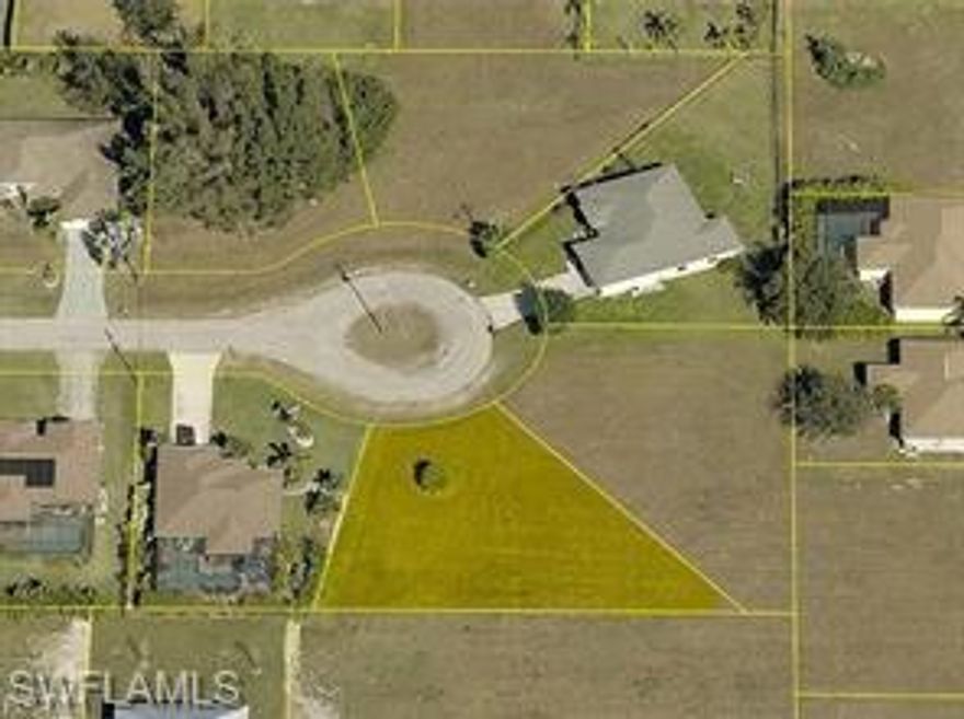 This cul-de-sac lot, fully fenced and ready to build, comes with its survey available. It's your chance to create your dream home in a central and desiderable NW area of Cape Coral. Not in flood zone and the owner going to being to pay the balance of assetsments. This cul-de-sac opportunity is one you can't miss!!.