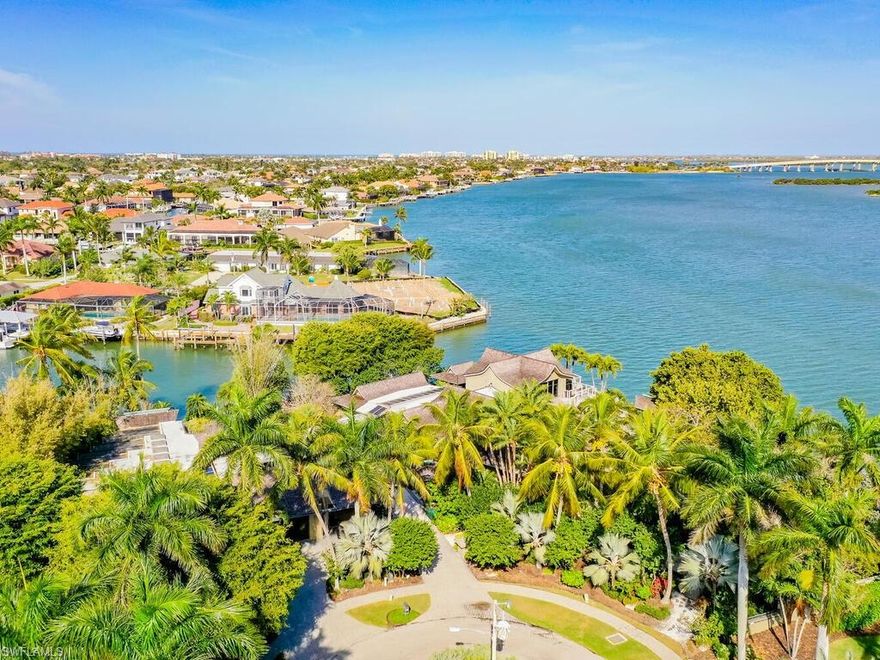 Premier tip view lots + 2 half key lots on Marco River with stunning bridge & Bird Island views. 568’ direct access waterfront. Open River views + protected dockage for your fleet. Main home (5373 sf ac) spectacularly built ahead of its time in 1981 & make-over 2006, Asian inspired decor. 2 BR’s, 2 offices, den, music rm, exercise rm, 3.5 baths,... Guest home (2709 sf ac) built 1975. 2006 addition & remodels. 3 BR’s, 3.5 baths, 2 dens, 2nd kitchen, 2nd laundry, 2nd tropical lanai with fireplace & koi pond, eclectic fanciful decor. Family compound mixes balance of togetherness & privacy connected by long gallery to display treasured art... Asian architecture inspired by celebrated Japanese imperial palace, Katsura, award winning botanical gardens (Christian Busk), winding paths, gazebos, water features welcome you into a sense of serenity, seclusion & natural beauty. Oversized windows thru-out overlook garden vignettes + glorious River views. Extensive decks & balconies. Stunning carved art glass thru-out, graceful custom staircase & water feature. Generator, Instant Hot Water (gas), mosquito NX tanks, security system…Featured in Gulfshore Life Magazine. One-of-a kind opportunity.