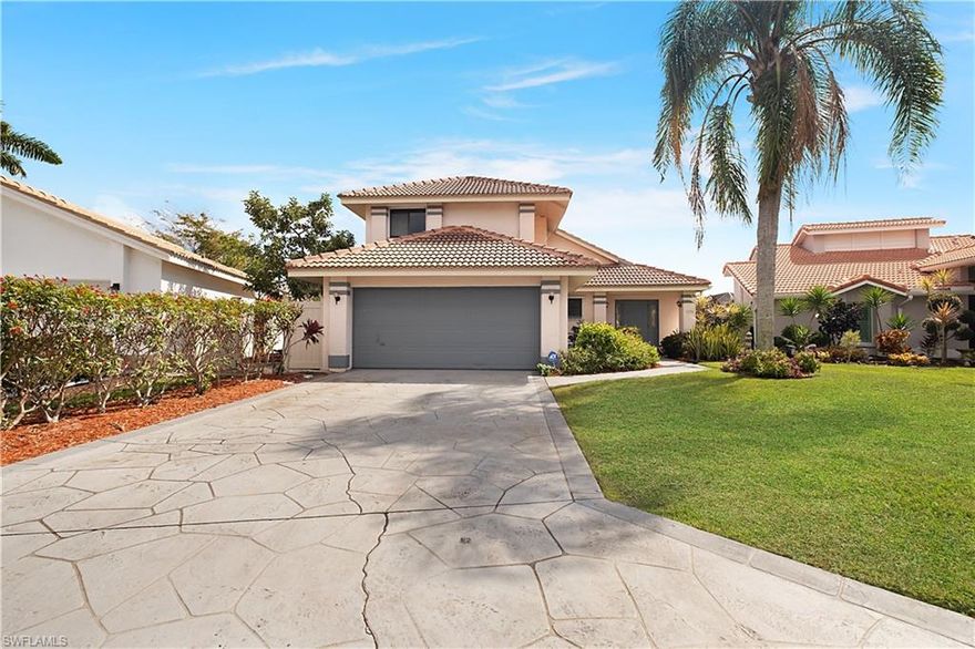 Welcome to this comfortable pool home in Moon Lake where entertaining comes naturally and everyday living feels relaxed. This residence features three bedrooms and two and a half bathrooms across 1,857 square feet designed for Florida lifestyle enjoyment. The enclosed pool area creates a private retreat surrounded by protective walls and fencing, ideal for family gatherings or peaceful afternoon relaxation. Step inside to discover generous living spaces filled with natural light from multiple glass sliders that connect indoor rooms to outdoor areas throughout the home. The main living area showcases volume ceilings and easy-maintenance tile floors that flow seamlessly between spaces. A convenient half bath near the living room serves guests with practical Corian countertops and thoughtful placement. The eat-in kitchen makes daily meal preparation and casual dining effortless with granite counters, wood cabinetry featuring soft-close mechanisms, ample pantry storage, and a unique pass-through window that opens directly to the covered lanai for seamless indoor-outdoor entertaining. Additional sliders from the kitchen lead to a charming private outdoor patio space perfect for morning coffee or quiet evenings. The primary bedroom suite offers peaceful separation with vaulted ceilings creating an airy atmosphere and direct access to the lanai. The ensuite bath provides comfortable amenities including a private water closet, separate shower and soaking tub, dual sink vanity with Corian counters, both standard and walk-in closets, plus a skylight bringing in natural illumination. Two additional bedrooms provide generous proportions for family or guests, sharing a well-appointed bathroom with tub and shower combination, neutral tile, convenient linen storage, and Corian counters. A versatile loft space upstairs creates the perfect spot for a home office, reading nook, or gaming area. Practical features include a two-car garage with room for at least four vehicles total and manual hurricane shutters for storm protection. Moon Lake delivers low-density single-family living within a secure gated community that includes a refreshing community pool and tennis court. Location advantages abound with downtown Naples and the vibrant dining, shopping, arts, and entertainment of historic Fifth Avenue South just five minutes away. The neighborhood provides convenient access to quality schools including highly rated Calusa Park Elementary, as well as nearby shopping destinations like Coastland Center with major retailers and family entertainment, or the upscale Mercato lifestyle center featuring Whole Foods, boutiques, and diverse restaurants. Recreation enthusiasts appreciate the Rich King Memorial Greenway, a three-mile paved trail perfect for walking, biking, or jogging that borders the community. The trail connects to quiet residential streets and offers canal views along portions of the route, providing safe traffic-free paths.