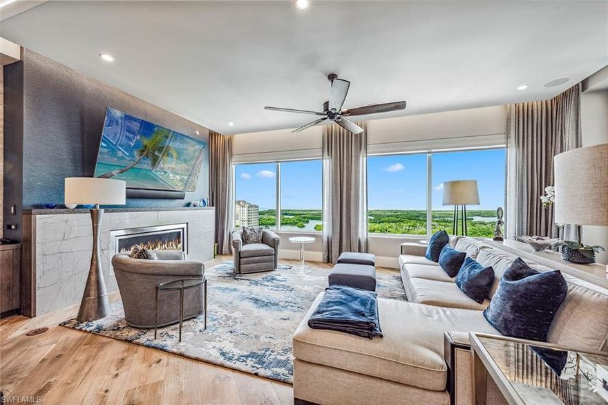 Naples coastal living offers luxury, comfort, and style, promising the good life with an array of aquatic activities including boats, a yacht club, and beaches, as well as moments of peace, grace, and beauty. Hardwood plank flooring, marble, and lush, sculpted pile carpets distinguish this residence. The chef’s kitchen features top-of-the-line appliances with a Wolf oven, propane gas cooktop, Zephyr elevated overhead fan, and a Sharp microwave oven for added convenience, anchored by a SubZero refrigerator. Marble accents the baths and facilities, while rich cabinetry and fully-fitted walk-in closets ensure convenience and allure. Exclusive to the penthouse is a select propane fireplace and a large wet bar with a 90-bottle wine chiller for entertaining, along with a lanai for grilling. The Control 4 automation system refines lighting, music, and television. Enjoy views of Naples' newest golf course to the east and the marina basin and Gulf to the west. The building offers three guest suites, billiards, a party room, sky lounge, theater room, and concierge services. Additionally, a private two-car garage is included. Aqua, located near Pelican Isle Yacht Club and Mercato Shops, promises to spoil you with the Gulf life and the amenities of central Naples.