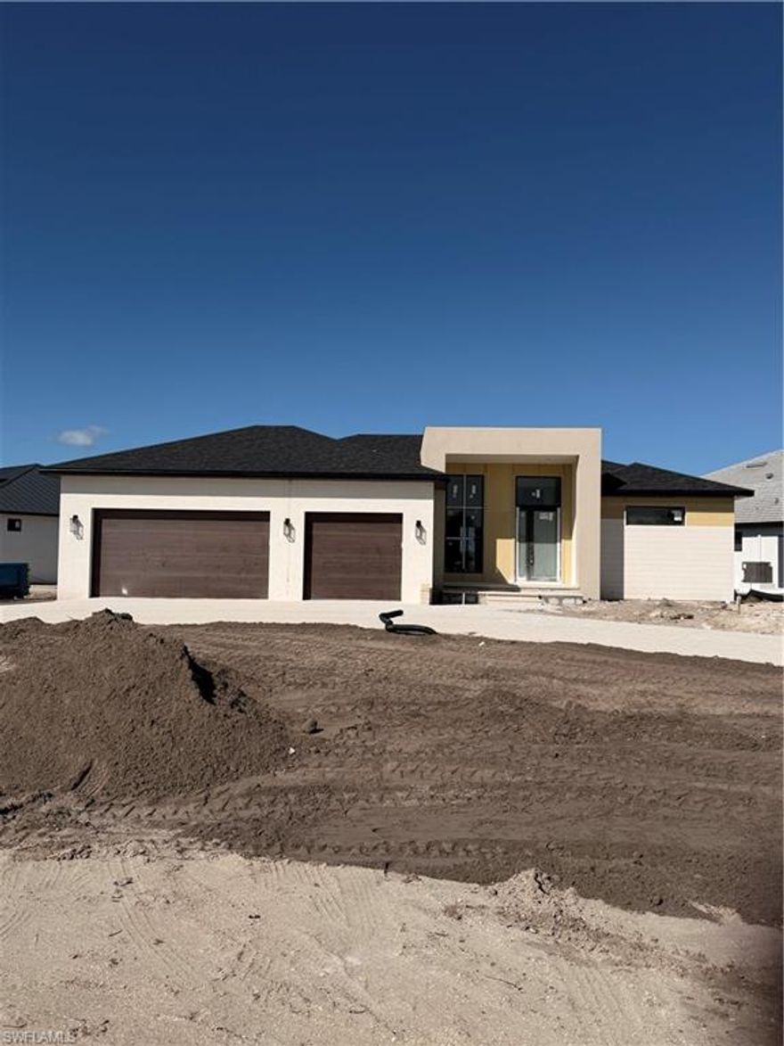 New Construction Gulf Access Pool Home.  Introducing the Concordia model, a brand-new Gulf access pool home built to current FEMA standards and thoughtfully designed for modern coastal living. This 3-bedroom, 3.5-bath residence offers 2,014 square feet of well-appointed living space, a spacious three-car garage, and a circular driveway that enhances both curb appeal and convenience. Impact-resistant windows and doors throughout provide durability, storm protection, and peace of mind. Enjoy true Florida resort-style living with a private pool, spa, pool deck, and picture-frame screen enclosure with panoramic views of the canal. The lanai will feature a fully equipped outdoor kitchen and a stylish shiplap ceiling, creating the perfect setting for entertaining or relaxing waterfront evenings. A newly installed seawall adds long-term value and security for your Gulf access lifestyle. Inside, upgraded tile flooring flows throughout the home. The living room showcases a custom entertainment wall with a built-in fireplace, creating a striking focal point. The gourmet kitchen features a waterfall-edge island with quartz countertops, blending functionality and contemporary design. The luxurious primary suite is designed as a private retreat, complete with a spa-inspired bath featuring dual shower heads and a spacious ensuite with his-and-her California Closets for optimal organization. Additional highlights include an epoxy-coated garage floor for a clean, finished look and a classic shingle roof for timeless appeal. This Concordia model offers the perfect blend of premium finishes, modern design, FEMA-compliant construction, and direct Gulf access.  Expected Certificate of Occupancy is February 25, 2026. Call today to schedule your private showing and secure this exceptional waterfront opportunity.