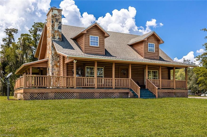 Tucked among mature trees in the heart of Montura Ranches, this unique 2,200 sq ft Red Cypress cabin blends rustic character with modern practicality on 2.5 fully fenced acres. Built of Red Cypress —this home is designed for lasting beauty and low maintenance. Inside, you’ll find rich woodwork throughout that brings warmth and authenticity to the living spaces. The fireplace in the living room and wrap around decks are so inviting. The primary suite is conveniently located downstairs, while two guest bedrooms sit upstairs along with a large loft area—perfect for an office, studio, or media space. Outside, the acreage is ready for your lifestyle with a large utility shed and a chicken coop/cage, plus plenty of room for gardens, animals, and outdoor toys.