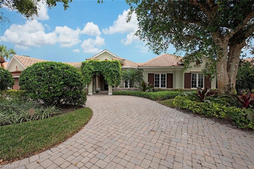 Discover this luxurious lakeside home boasting casual elegance, located in the gated enclave of Georgetown, rebuilt to perfection in 2010.  Paved circular drive leads to covered pergola & courtyard to welcome you. Soaring ceilings, use of glass enhance lake views creating an ideal home for entertaining. Gourmet kitchen would thrill any chef with 6 burner Wolf gas range, island prep sink, sub-zero refrigerator & freezer, quartz counters, & walk-in pantry.  Open to great room with fireplace & views to lake.  The formal dining room & den open with French doors to lush courtyard. Split bedrooms with master suite on one side & two en-suite guest rooms off their own hallway. The master boasts walk-in closets, luxurious  bath, & large shower. Covered lanai has cypress ceilings, wet bar, built-in gas grill, & cabana bath. Guest house is equipped with a contemporary murphy bed, full bath & kitchenette with views of pool/lake. Features: wood floors, 3 fireplaces, built-in bookcases, wet serving bar, wine chiller and surround sound wired. Located in the heart of Pelican Bay, amenities include beach access with dining, fitness center, tennis, kayaking, & nature walks. Enjoy this Naples jewel!