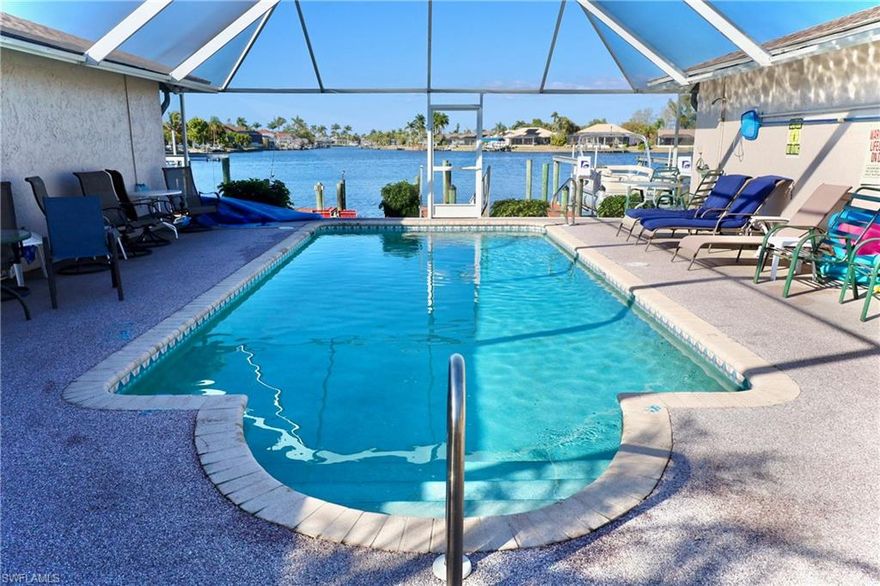 Enjoy peaceful waterfront living in this beautiful lakefront condo, perfectly located just off Cape Coral Parkway and within walking distance to Publix and other nearby shops and conveniences.

This spacious, Gulf access condo offers boating access through Redfish Cove and sits along the desirable south end of Lake Louise, providing a quiet and private setting. With only four units sharing the courtyard, you will appreciate the intimate atmosphere and well maintained surroundings.

Step inside through the covered entry into a welcoming foyer that opens to a bright open concept great room. Sliding glass doors lead to a private screened lanai, perfect for relaxing and enjoying the Florida breeze. From the beautifully maintained courtyard, you can take in the incredible views of Lake Louise while enjoying the caged community pool and peaceful waterfront setting.

Boating enthusiasts will love the community dock space along with this unit’s private boat slip with no lift. The condo is being sold turnkey with furniture negotiable, making it move in ready or ideal as a seasonal retreat.

The updated kitchen features granite countertops and flows conveniently into the laundry area, which offers additional storage. Tile flooring runs throughout the home for easy maintenance. The split bedroom layout provides privacy, with the primary suite positioned separately from the guest bedroom and bath.

Additional highlights include a newer roof replaced in 2023 and close proximity to downtown Cape Coral dining and entertainment.

With its lake views, Gulf access, and prime location, this one is sure to attract attention.