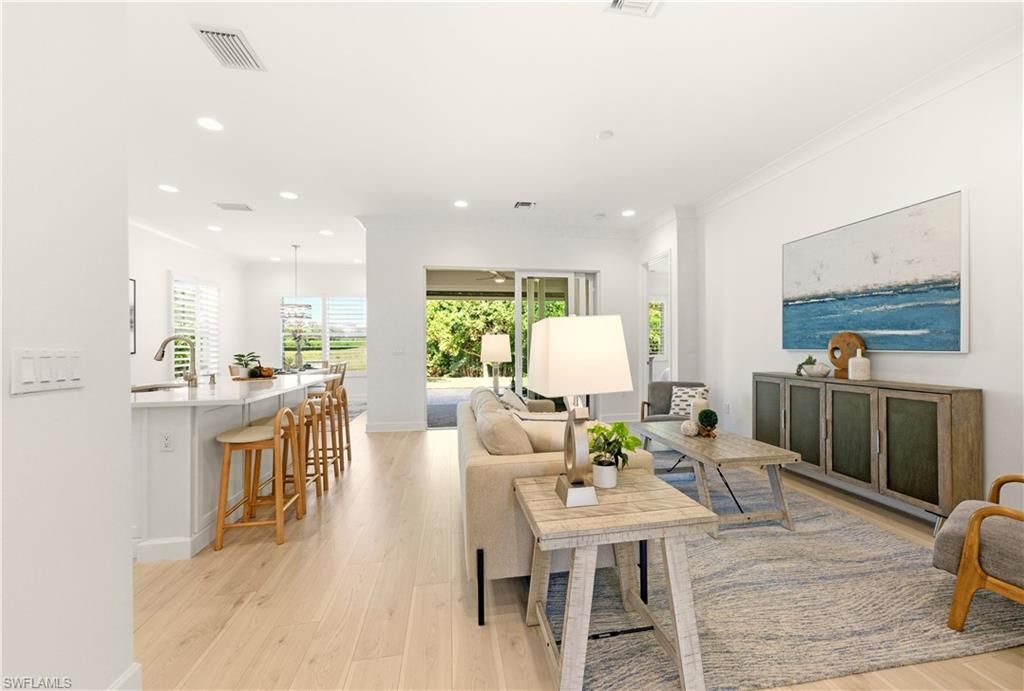 Photo of 11323 Jacaranda DR, NAPLES, FL 34120 (MLS # 225083973)