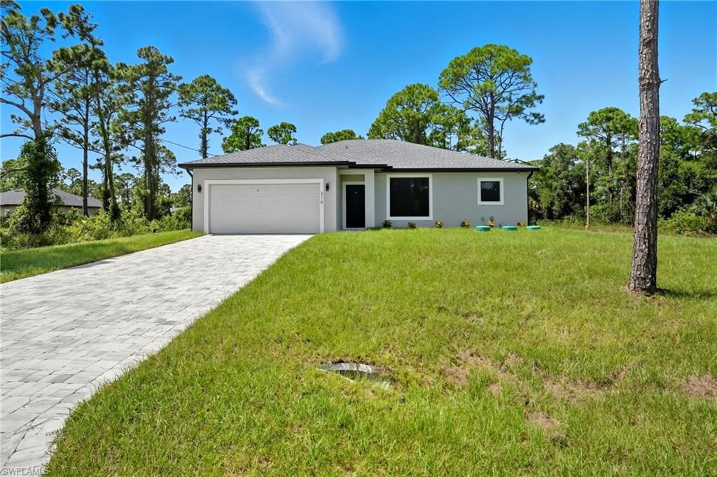 Photo of 216 Ogden AVE S, LEHIGH ACRES, FL 33974 (MLS # 226016201)