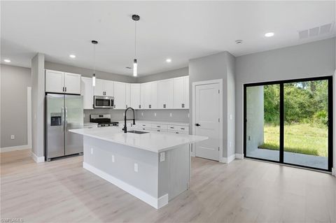 Photo of 216 Ogden AVE S, LEHIGH ACRES, FL 33974 (MLS # 226016201)