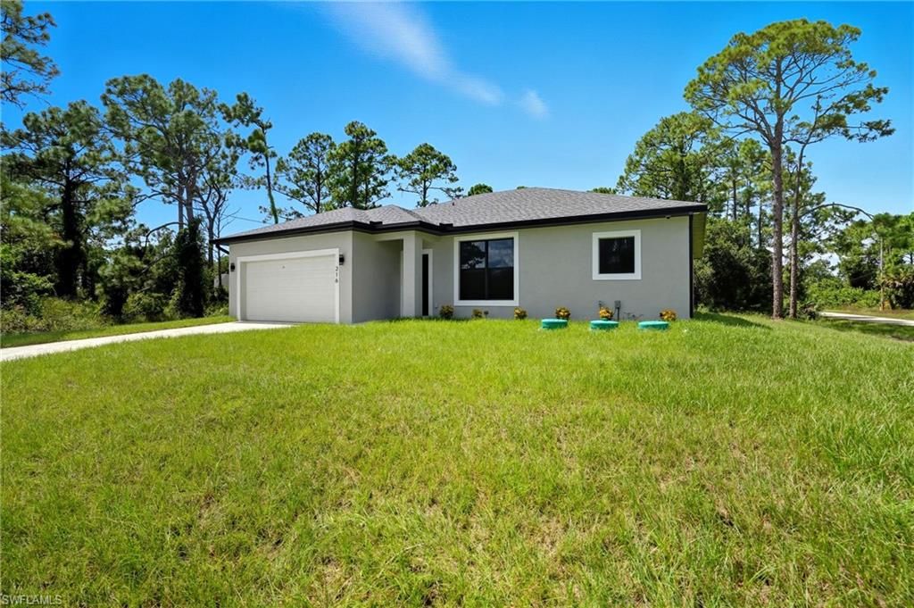 Photo of 216 Ogden AVE S, LEHIGH ACRES, FL 33974 (MLS # 226016201)