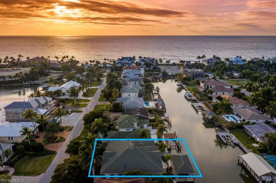 This charming GULF ACCESS Conners residence must be experienced in person to truly appreciate! Located just steps from Vanderbilt Beach off Gulf Shore Drive, this spacious three bedroom plus den home features two open air terraces, boat house and dock with fish cleaning station, custom built-in bar, brick fireplace, hardwood flooring, vaulted ceilings, plantation shutters, spa and so much more, as the property includes a non-conforming lower level that allows it to live so much larger than its indicated square footage. Fantastic home for beach lovers and boaters alike, this is an exclusive opportunity not to be missed!