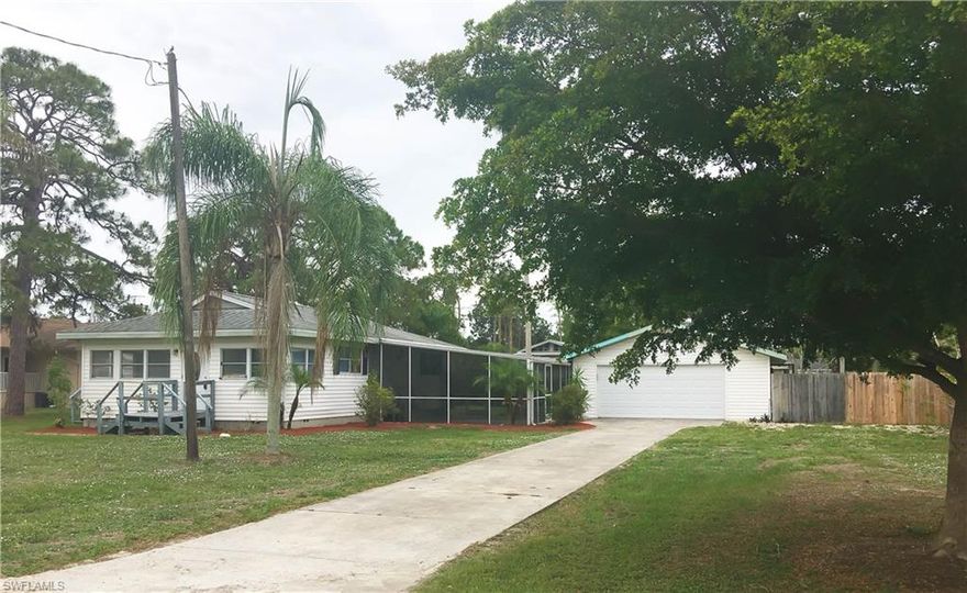 MOTIVATED SELLER!! THE ONLY HOME UNDER $200,00.00 NOT in a Gated Community in ESTERO!! WOULD MAKE A GREAT RENTAL!! MAKE AN OFFER!! OLD FLORIDA CHARM! Quaint Bungalow. Home & Garage sit on 2 BUILD-ABLE LOTS!, Fenced Back Yard with Tropical Fauna!  30 x 30 LARGE Detached Garage with Room for Workbench's! LARGE Screened area attached between garage and home. Roof is only 5 years Old! Wood Laminate Floors, Galley Kitchen, 2-3 bedrooms or an office! Charming Country Feel in the City! Great Location! Near FGCU, The Finest Malls, and SW Florida Beaches!!