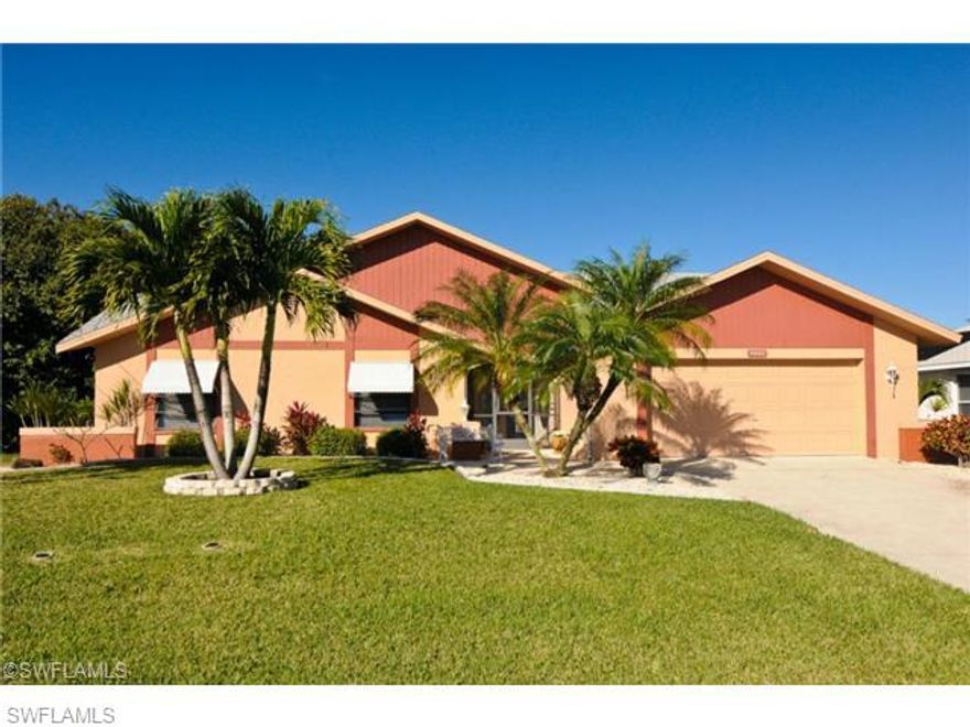 GULF ACCESS - Meticulously maintained waterfront home. Spacious, open, split floor plan with 3Bed/2Baths and 2,262 sq. ft., of tile throughout. Huge screened lanai, featuring salt water solar/electric heated pool & spa. Enjoy the outdoor kitchen and living space for plenty of entertaining. Wrap around boat Dock with 7,000lb Boat lift. Home has been well taken care of!! ASSESSMENTS IN AND PAID!! This is a must see, please schedule your showing today!