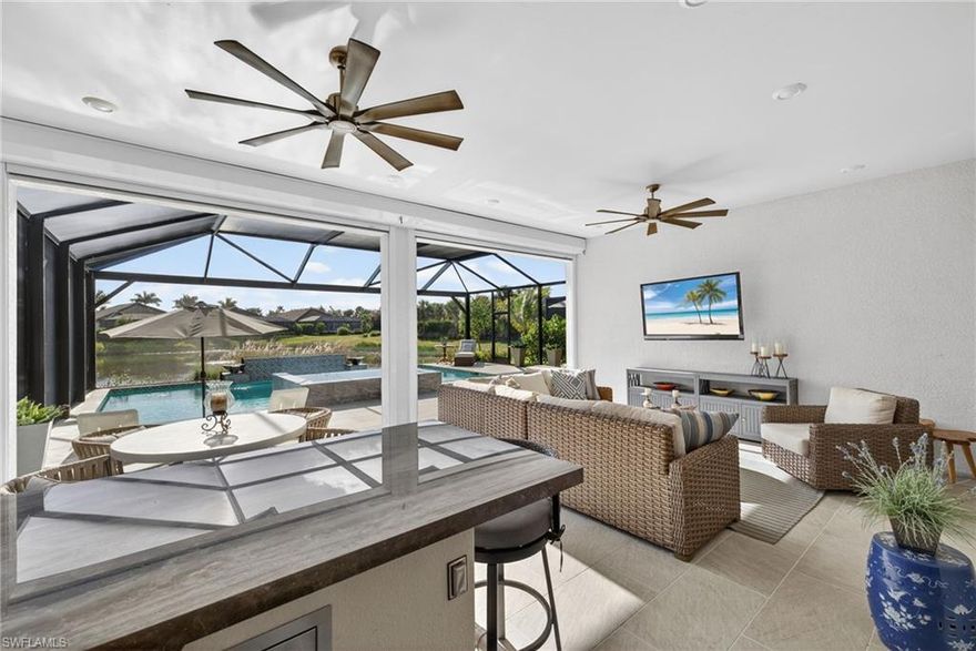 Absolutely Beautiful, like no other, Well thought out Lazio Model Saltwater Custom Pool home in Esplanade by the Islands. No Flood Insurance needed here. Put your mind at ease while living in a Florida home with a Whole house Generator, Hurricane Electric shutters and Hurricane Impact Glass. Why build when you can get this highly upgraded 3 bedroom plus den Custom Pool home with oversized Spa, 5 water features which include water bowls, sheer descent wall, bubblers and spillover spa. Extra large Spa and Sundeck. Lanai pavers are porcelain set in a concrete foundation. The lanai is extended with An Outdoor kitchen with vented grill that adds to the specialness of this home offering an opportunity to  entertain and grill out with your friends and family. Inside you will find 10 ft ceilings with highly upgraded options which include a Decorative glass front door, Tile floors that look like wood. High end Cabinetry. Solid Quartz Countertops in the kitchen and bathrooms. Full Built in Closet System in the Primary Bedroom. Freshly painted epoxied 3 Car Tandem Garage. Tankless water heater. A Gourmet kitchen along with after market Mill Work enhanced by an Elegant electric Fireplace. Quite simply a masterpiece designed by an artist eye! All of this on a 150 ft lot! 
The amenities at Esplanade by the Islands have recently been completed which include a beautiful resort style pool, Bahama Bar, Pickleball courts, Tennis courts and a state of the art attended fitness center. Indulge yourself in all the various spa services! The Bahama Bar and Cafe are offering delicious dishes. The Culinary Center will be opened in about a year offering an elegant Country Club atmosphere with Wine Tastings, Cigar clubs, Whiskey tastings and fine dining meals. 
The Location of Esplanade by the Islands community sits perfectly between Marco Island and downtown Naples Florida. Literally 20 minutes to Marco Island and 20 to 25 minutes to Olde Naples Beaches and 5th Avenue! This is truly one not to be missed! If you are a Golfer, there are public golf courses nearby! Two world renowned courses in Lely Resort which is a 6-10 minute drive away. If you are a Boater, the Marina in Goodland FL sits 12 minutes from the entrance of our Community for you to rent a boat for the day, store your own boat, or jump on a tour to take you shelling or fishing! Whatever your Southwest Fl. interests are, this location has everything right at your fingertips! 5 Star Restaurants, Shopping, Boating, Golfing....You name it...It is here for you!