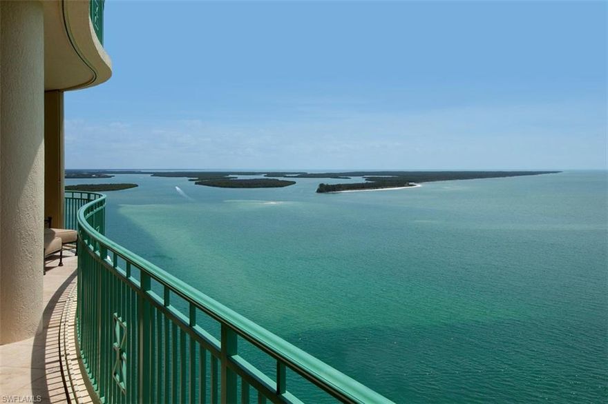 Impressive penthouse offering the ultimate in waterfront living boasting over 7100 sq ft of opulent  living space. Captivating panoramic views of the Gulf & 10,000 Islands. Expansive & private terraces. Southern exposure.  Sophisticated coastal elegance, distinctive architectural details, lavish upgrades, specialty electronics, extensive custom design, elegant furnishings & incredible attention to detail, craftmanship, & function.  Elegant grand salon with wall of windows for Gulf views offers stunning marble floors with intricate glass inlay, elaborate faux finishes, entertaining bar, one touch lighting & music. The sprawling interior makes entertaining a pleasure with all rooms opening up seamlessly to the outside living spaces.  Formal dining with coiffered ceiling & artisan detailing comfortably seats 10  Gourmet kitchen offers Viking range, extensive upgrades & enlarged Island. Family room with fireplace, Brazilian mahogany floors & custom entertainment center is surrounded by water views.  Elegant master suite is a private sanctuary with luxurious bedding, lavish spa like master bath & sauna. 4 private guest suites for family, plus den/office media room. Rare 2 car A/C garage