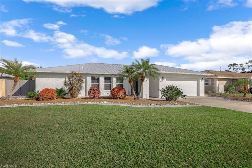 SELLER SAYS SELL!!, JUST REDUCED, this wonderfully remodeled, like new 3 bedroom, 2 bath home is a delight to see.  You will be impressed with all of the many choices these sellers have made including a New Metal Standing Seam Roof, with additional hurricane straps, new A/C, new Hot Water heater, Hurricane windows, an installed security system, all new hurricane sliders to patio with additional lanai hurricane protection and more.  Designer touches include contemporary flat panel cabinets, beautiful granite counters, tiled back splash, smudgeproof stainless appliances, built-in desk area, French doors lead out to a spacious screened lanai area and on out onto a paver patio with gazebo in the large yard with numerous fruit baring trees and shrubs.  This home is TRULY A BUYERS DELIGHT AND WILL NOT REMAIN ON THE MARKET VERY LONG!